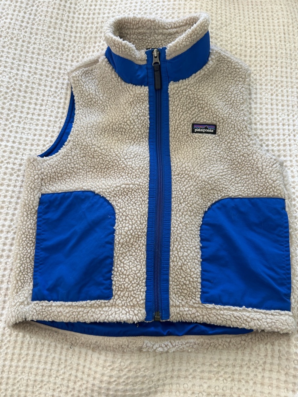 Patagonia Kids Cream Sherpa Vest with Bright Blue Trim and Pockets